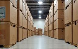 Stacked boxes of tiles in a clean warehouse environment